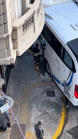 Bus gets stuck under building overhang in Buenos Aires