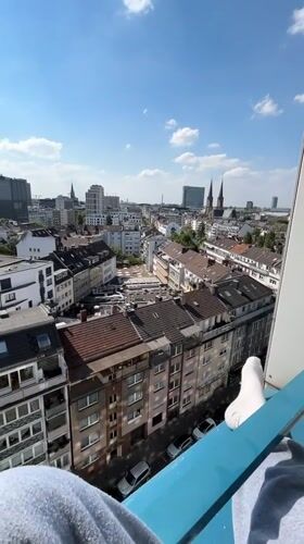 Elevated cityscape view captured in Düsseldorf on clear afternoon