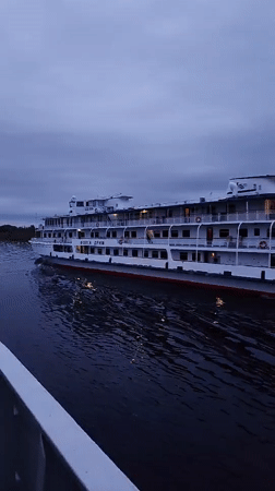 Cruise ship Volga Dream spotted on Russian river at dusk