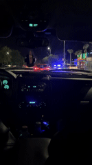 Police vehicles follow red car at Plovdiv intersection