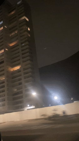 Nighttime view of apartment buildings captured in Arica, Chile