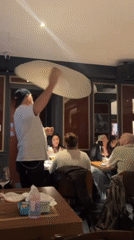 Chef performs traditional pizza dough spinning demonstration in Rome