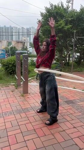 Hula hooping and bar work at a Busan park