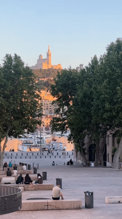 Evening gathering at Marseille's Vieux-Port draws crowds to waterfront square