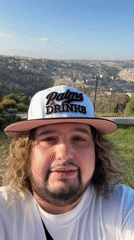 Man in branded cap photographed in Jerusalem