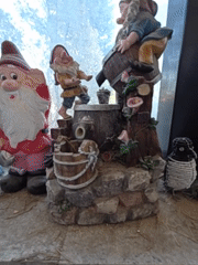 Garden gnome collection on a windowsill in Ra'anana