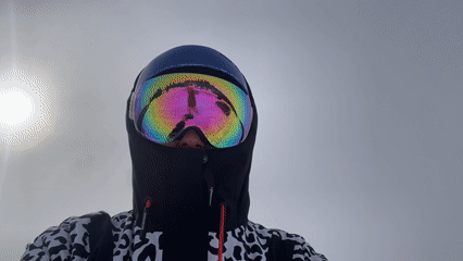 Person in blue helmet observed in snowy Russian mountains