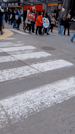 Pedestrians cross marked crosswalk in Ushuaia, Argentina