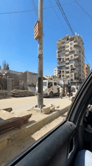 Street-level views of a busy Gaza neighborhood midmorning