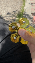 Person plays with fidget spinner across Yerevan locations
