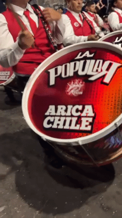 Elaborate costumed street festival celebrates through night in Arica