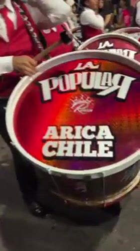 Elaborate costumed street festival celebrates through night in Arica