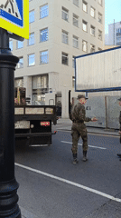 Moscow street scenes show military personnel, theater during sunny afternoon