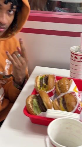 Person enjoys In-N-Out meal in La Quinta restaurant