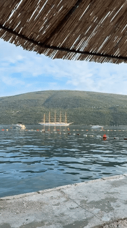 Tall ship anchored in a quiet Montenegro bay