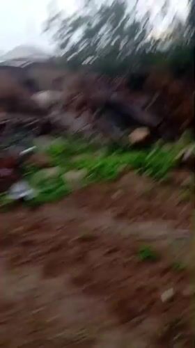 Everyday life around a modest Nigerian compound yard