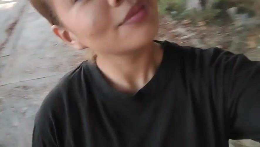 Woman Films Kissing Selfie Video on Porlamar Sidewalk