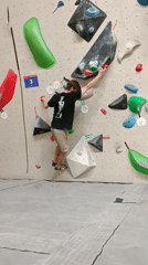 Man rock climbs indoor wall in Krasnoyarsk
