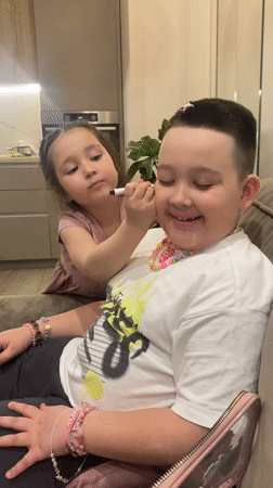 Person photographed with blue heart object in Izhevsk