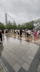 Crowd gathers at Haizhu plaza after rainfall