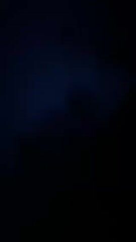 The video shows a dark, grainy image. There are subtle blue tinges in the darkness.