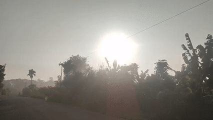 Sunrise road scene captured in rural Indonesian village