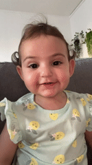 Baby plays on couch in Strasbourg home