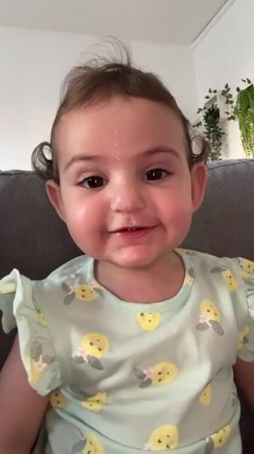 Baby plays on couch in Strasbourg home