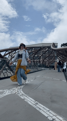 Woman photographs herself on ornate bridge in Sochi
