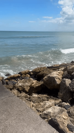 Surfer rides waves, wipes out near Kuta coastline
