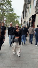 Pedestrians captured walking busy Barcelona street scene Sunday afternoon