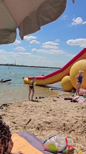 Summer day at a sandy lakeside beach in Yelyzavetivka
