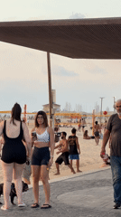 Soccer and strolls on a Tel Aviv beach at sunset.