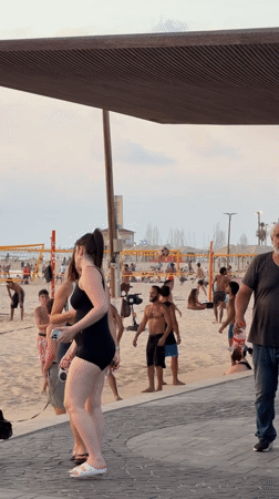 Soccer and strolls on a Tel Aviv beach at sunset.