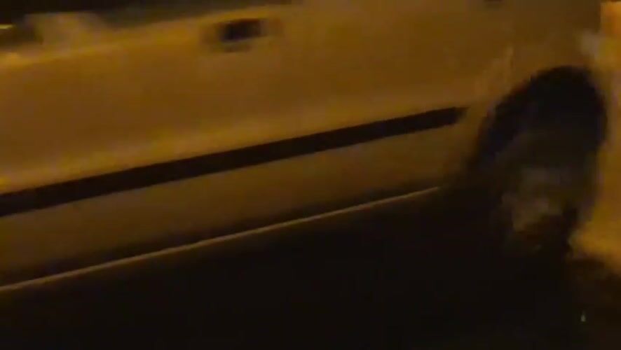 Rainy night driving through Taranto's wet streets