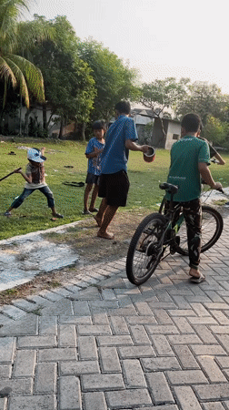 Morning street life across two East Java neighborhoods