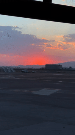 Red sunset viewed from airport terminal in Zapote del Valle