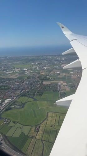 Aircraft passenger captures aerial view over Dutch farmland