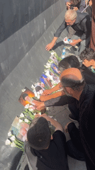 Flowers, portraits, and prayer at a Tehran memorial gathering