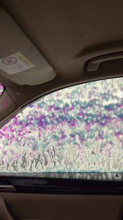 Car wash bubbles filmed from inside vehicle in Moscow