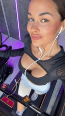 Woman takes gym selfies during treadmill workout in Krasnoyarsk
