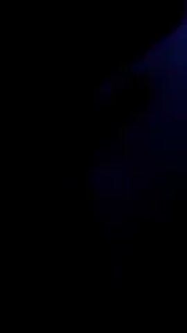 Here is a description of the video:

The video shows a crowd of people at an outdoor concert at night. The stage is brightly lit with purple lights, and there are laser lights shooting into the sky. A DJ is performing on stage. The music is loud and upbeat. The crowd is dancing and enjoying the show. The overall atmosphere is energetic and exciting.