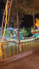 Nighttime amusement park activity captured in Khujand, Tajikistan
