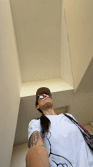 Woman films selfie video while walking down stairwell in Pleven