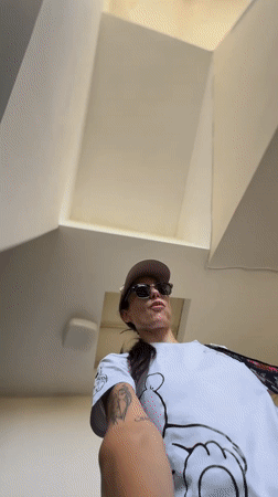 Woman films selfie video while walking down stairwell in Pleven