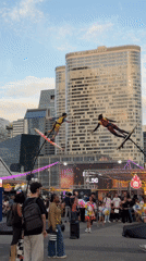 Aerial wire performers draw a crowd near La Défense