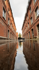 Wet courtyards and red brick details at a Moscow historic compound