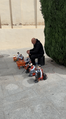 Street performer with marionettes, inflatable Pikachu entertain in Seville