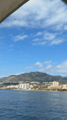 Woman pilots motorboat off Spanish coast near Benalmádena