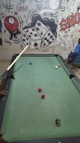 Pool game underway in Akwanga, Nigeria indoor venue